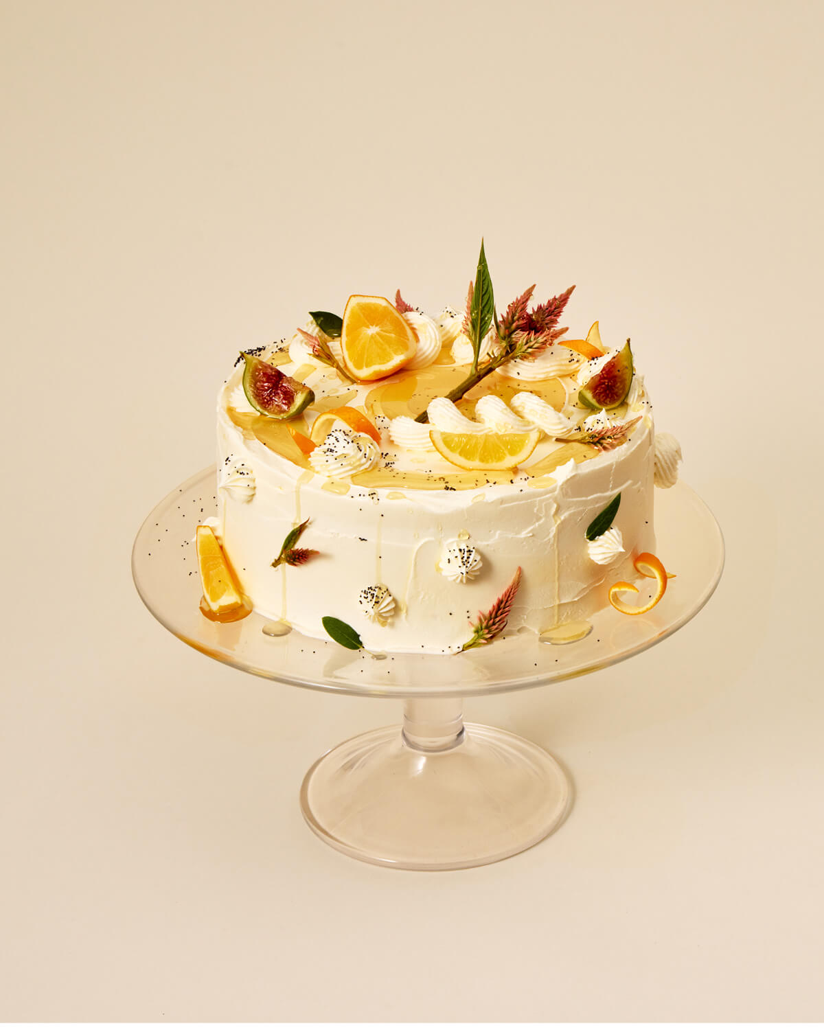 Decorative cake with fruit on a beige background