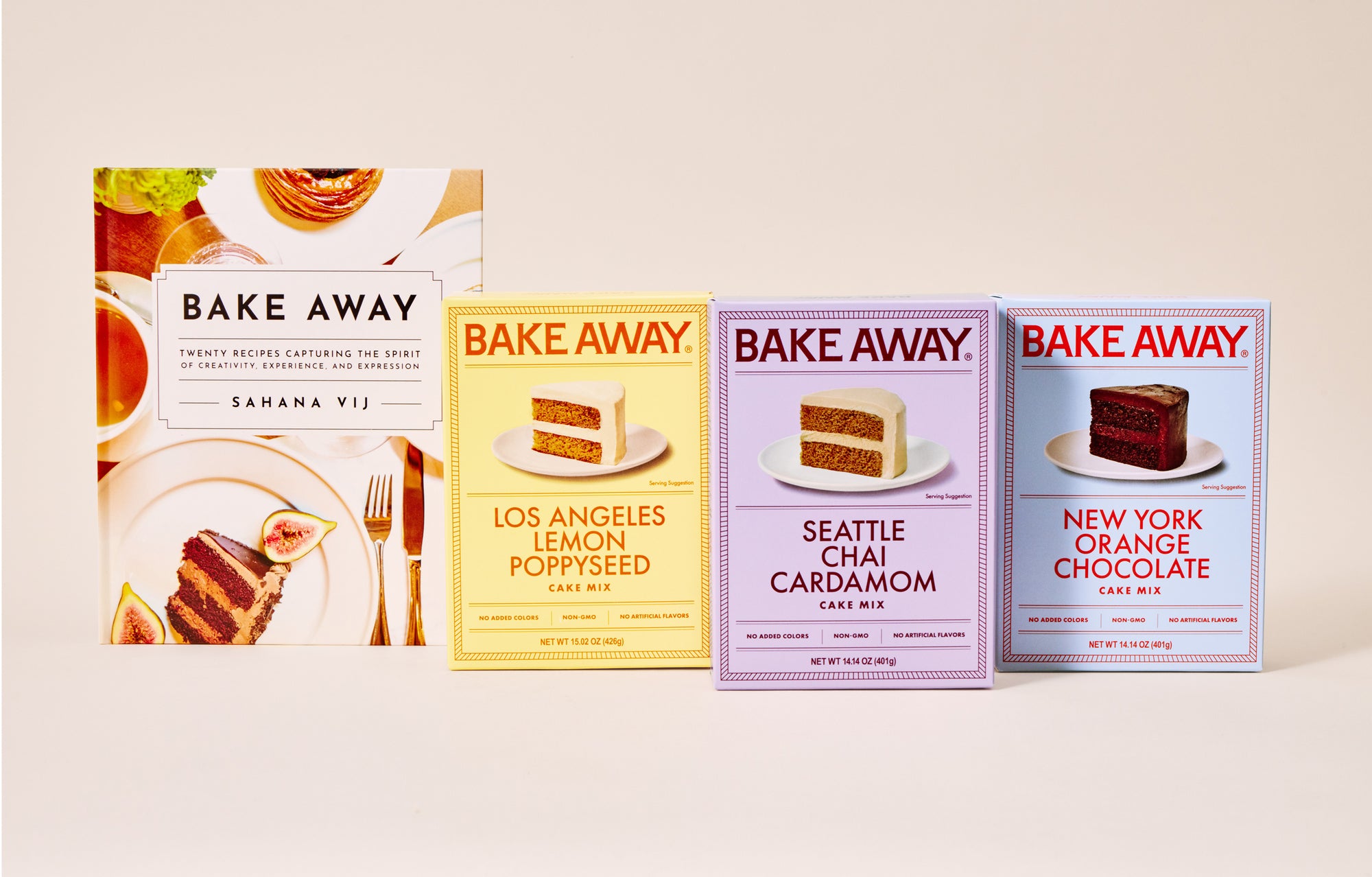 Three 'Bake Away' cake mix boxes with different flavors on a beige background next to a Bake Away cookbook by Sahana Vij