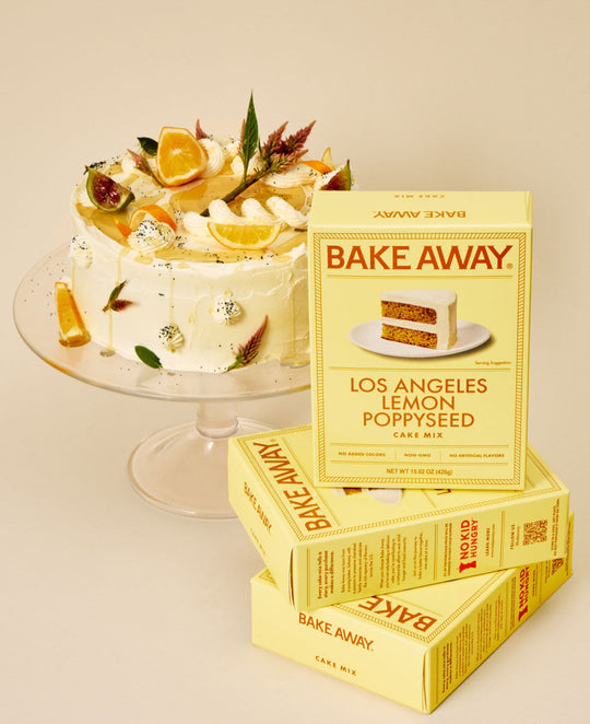 Bake Away Los Angeles Lemon Poppyseed cake mix boxes with a decorated cake on a beige background